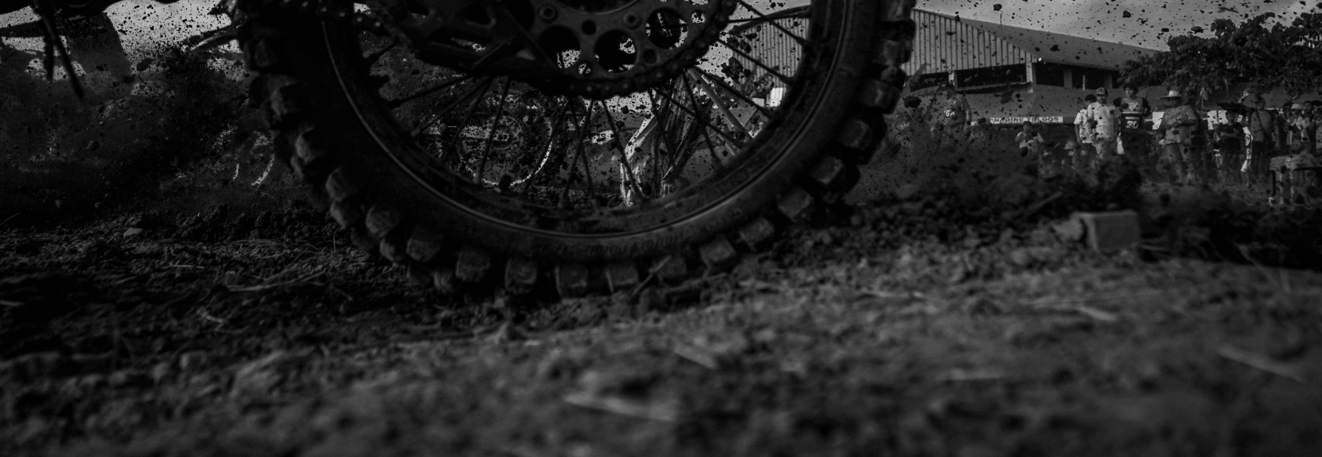 Motocross tyre spinning in the dirt - banner image